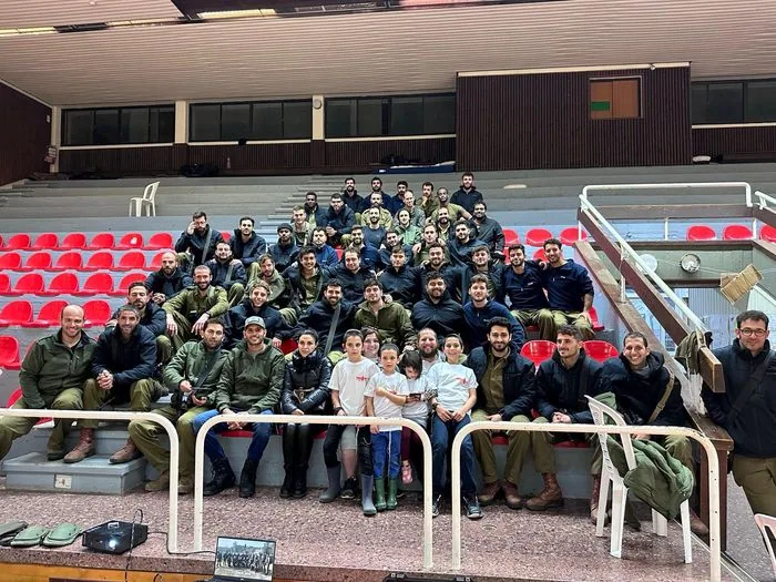 Natan's unit stationed at a makeshift base inside a basketball court. Tzion and Menachem brought a full barbecue.