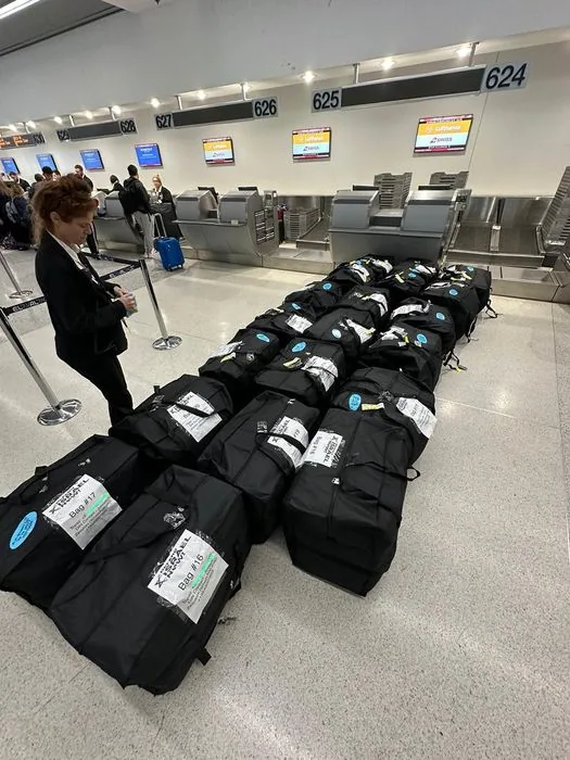 Duffle bags and suitcases filled with donated supplies wait to be flown to Israel.