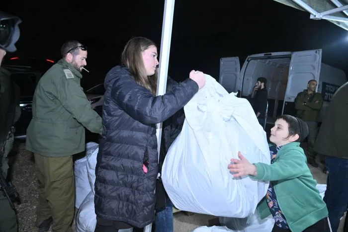 Distributing gear to soldiers.