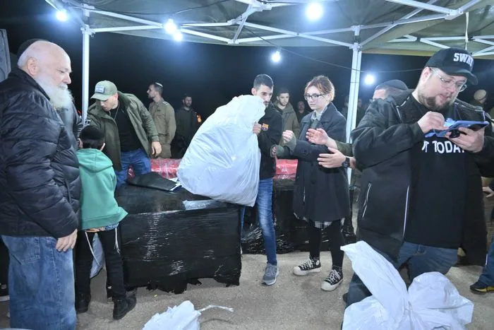 Distributing gear to soldiers.