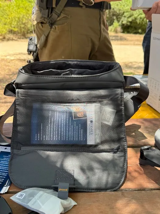 Surrender by drone — a Mavic outfitted with a remote speaker.