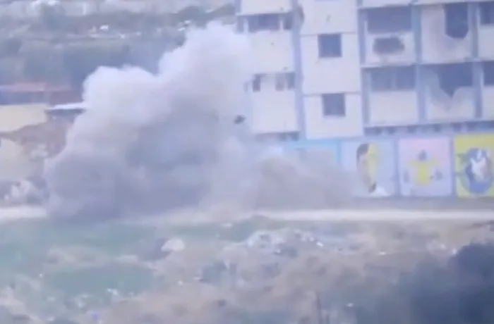 The jeep detonates on impact. Tzur's teammate is not wearing an upgraded vest and is killed instantly.