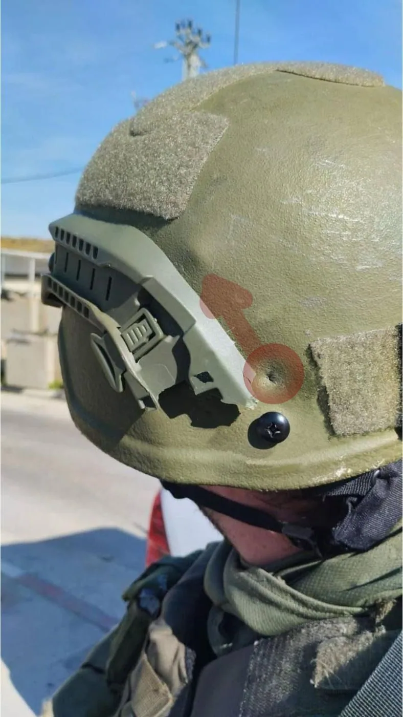 Natan's helmet. The highlight shows the bullet's entry point and trajectory — a full 90° turn from entry point.