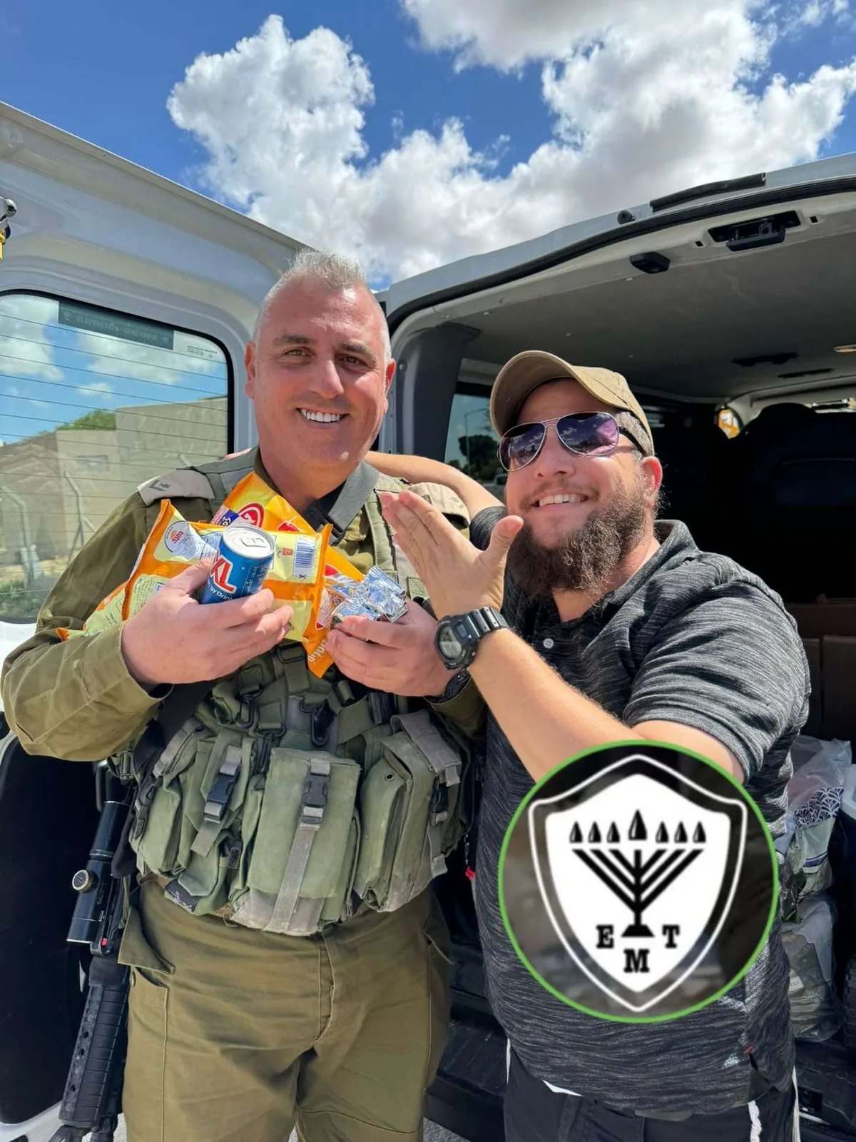 Soldiers gathered around a Heart and Soul refreshment stop.