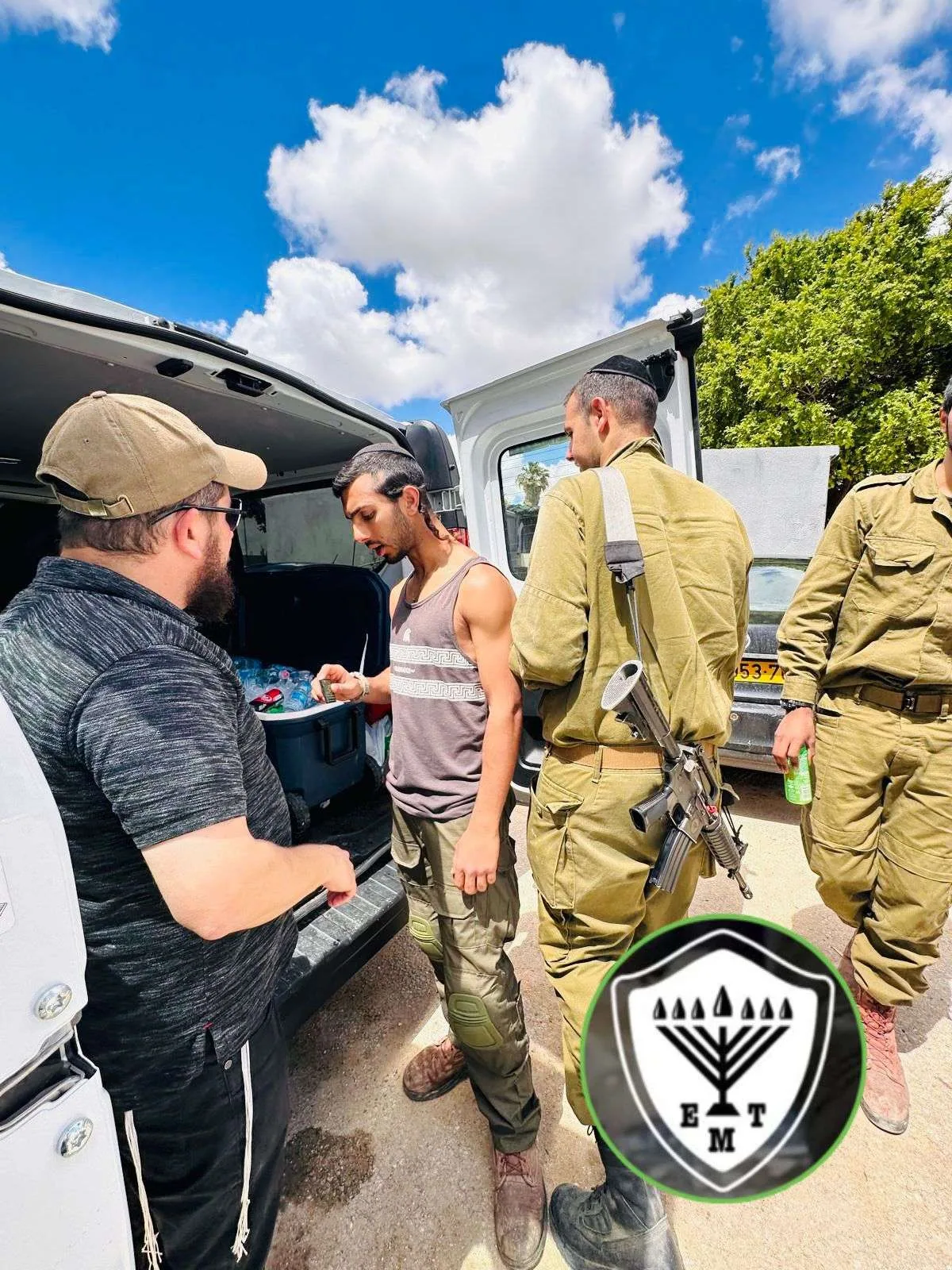 Volunteers handing out supplies to soldiers.